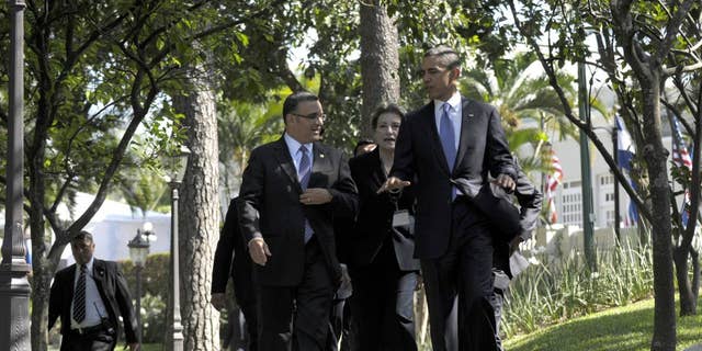 President Barack Obama and President of El Salvador President Mauricio Funes walk to a joint press conference at the Casa Presidential in San Salvador, El Salvador, Tuesday, March 22, 2011. (AP Photo/Susan Walsh)