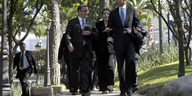 President Barack Obama and President of El Salvador President Mauricio Funes walk to a joint press conference at the Casa Presidential in San Salvador, El Salvador, Tuesday, March 22, 2011. (AP Photo/Susan Walsh)