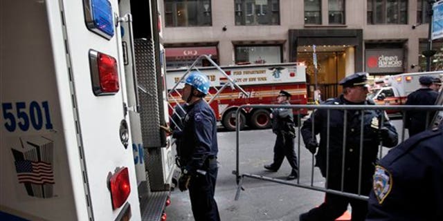 Dec. 14: Emergency personnel gather outside of a building where there was an elevator accident in New York. A woman was killed when her foot or leg became caught in an elevator's closing doors, New York City fire officials said Wednesday.