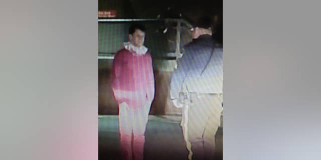 In this image taken from video and provided by the Riverdale, N.J. Police Department, Brian Chellis, 23, of Cedar Grove, N.J. talks with a Riverdale police officer after being found passed out in a car early Dec. 20, 2014. Police say that they found the man, who dressed as an elf, asleep behind the wheel of a van with its engine running, lights on and music blaring. Chellis, who faces drunk driving charges, was issued a summons and released to a family member. (AP Photo/Riverdale Police Department)