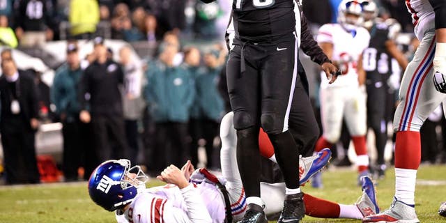 Oct 19, 2015; Philadelphia, PA, USA; Philadelphia Eagles defensive end Vinny Curry (75) reacts after pressuring New York Giants quarterback Eli Manning (10) into intentional grounding during the fourth quarter at Lincoln Financial Field. The Eagles defeated the Giants, 27-7. Mandatory Credit: Eric Hartline-USA TODAY Sports
