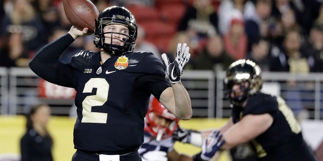 Purdue quarterback Elijah Sindelar, left, throws against Arizona during the first half of the Foster Farms Bowl NCAA college football game Wednesday, Dec. 27, 2017, in Santa Clara, Calif. (AP Photo/Marcio Jose Sanchez)