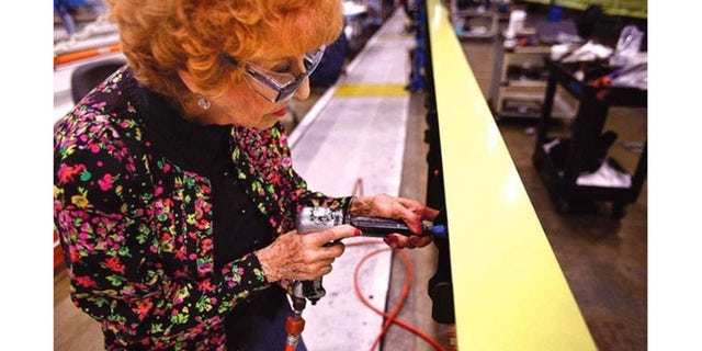 Elinor Otto riveting.