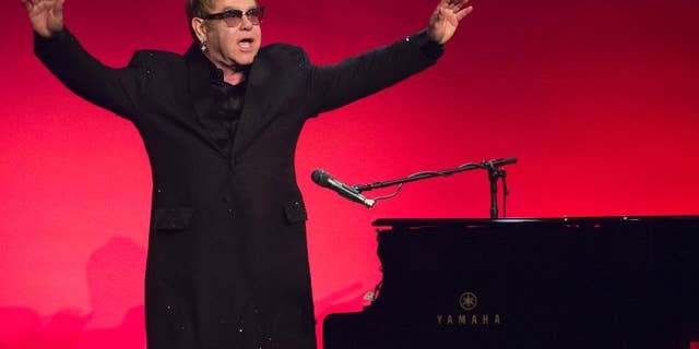 Elton John performs at 2014 AIDS Foundation Benefit.
