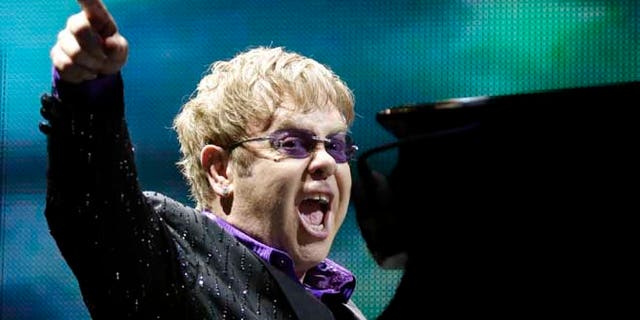 This June 30, 2012 file photo shows British pop star Elton John performing during the Euro 2012 soccer championship in Kiev, Ukraine.