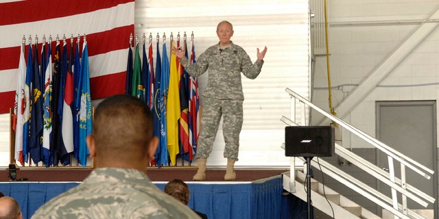 June 17, 2013: Army Gen. Martin Dempsey, the chairman of the Joint Chiefs of Staff, speaks with soldiers at Minot airforce base in Minot, N.D.