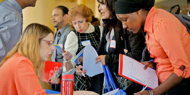 Job seekers attend the New York Department of Citywide Administrative Services (DCAS) 2016 job fair, Wednesday Nov. 2, 2016, in New York. U.S. employers added a decent 161,000 jobs in October 2016 and raised pay sharply for many workers. It was the final major report on a lukewarm but durable economy before Americans choose a new president next week. (AP Photo/Bebeto Matthews)