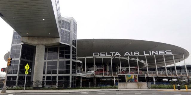 FILE - This May 24, 2013, file photo shows the empty Delta airlines terminal 3 at JFK airport in New York. The National Trust for Historic Preservation has released its 2013 list of 11 Most Endangered Historic Places and the Worldport Terminal is on the list. The unique flying-saucer-shaped Worldport Terminal built by Pan Am in 1960 at New Yorkâs Kennedy Airport was a symbol of the jet age. Itâs where The Beatles first arrived in the U.S., along with millions of other travelers. But itâs become rundown and outdated, and asbestos abatement made renovations costly. Delta Air Lines recently abandoned the terminal for a new building, and demolition crews have already begun work on the futuristic structure from the past. (AP Photo/Mary Altaffer, File)