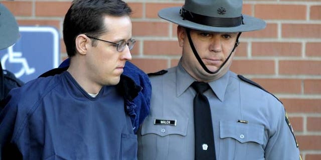 Jan. 5, 2015: In this file photo, Eric Frein, left, is led from the Pike County Courthouse after his preliminary hearing in Milford, Pa. (AP)
