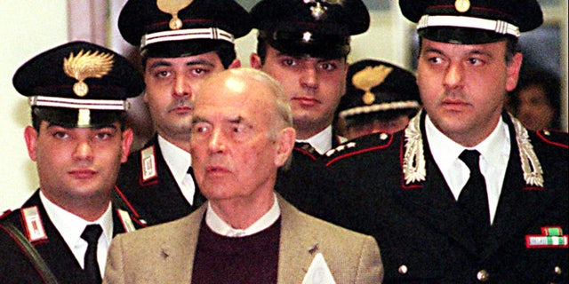 In this Thursday, Dec. 7, 1995 file photo, Former Nazi SS officer Erich Priebke enters the military court in Rome. Priebke, a former Nazi SS captain, was sentenced to life in prison for his role in one of the worst atrocities by German occupiers in Italy during World War II. In 1994, Priebke was extradited to Italy from Argentina and put on trial for his role in the 1944 massacre outside Rome. Nazi forces killed 335 civilians to avenge an attack by resistance fighters that killed 33 members of a Nazi military police unit a day earlier. Priebke admitted shooting two people and rounding up victims, but insisted he was only following orders.