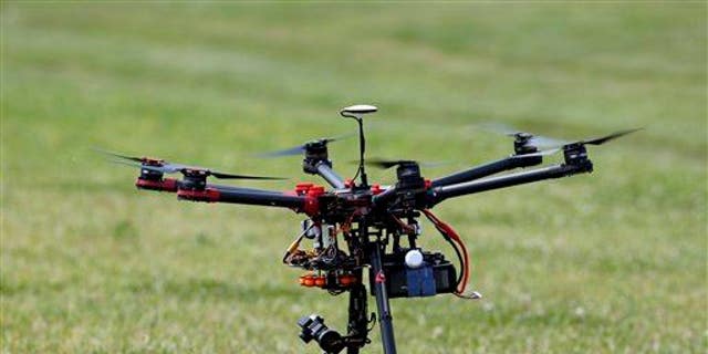 In this photo taken June 11, 2015, a hexacopter drone is flown during a demonstration in Cordova, Md.