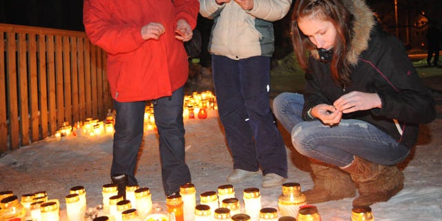 Feb. 20, 2011: People light candles in memory of children who died after fire raced through an orphanage for disabled children in Haapsalu, western Estonia.