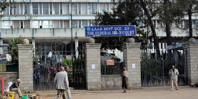 Nov. 1, 2011: Pedestrians walk past the Federal High Court building in Addis Ababa, Ethiopia.