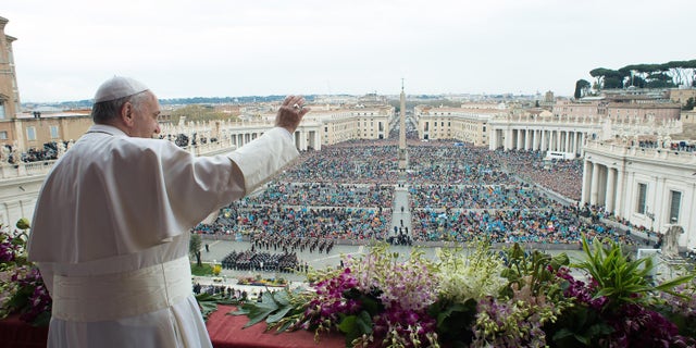 FILE - In this Sunday April 5, 2015 file photo, Pope Francis delivers the Urbi et Orbi (to the city and to the world) blessing at the end of the Easter Sunday Mass in St. Peter's Square at the Vatican. (AP Photo/L'Osservatore Romano, Pool, File)