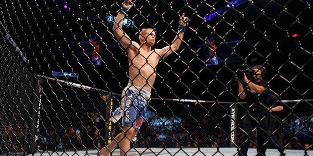 VANCOUVER, CANADA - JUNE 12: UFC fighter Evan Dunham celebrates his win over Tyson Griffin during UFC 115 at General Motors Place on June 12, 2010 in Vancouver, British Columbia, Canada. (Photo by Jeff Vinnick/Zuffa, LLC via Getty Images) *** Local Caption *** Evan Dunham;Tyson Griffin