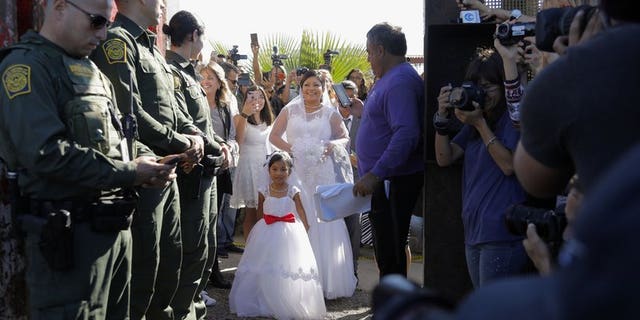 November 18, 2017: Evelia Reyes married a U.S. citizen banned from Mexico during the "Doors of Hope" event. The groom has been revealed as a convicted drug smuggler, leaving border patrol agents furious for providing security for "a cartel wedding."