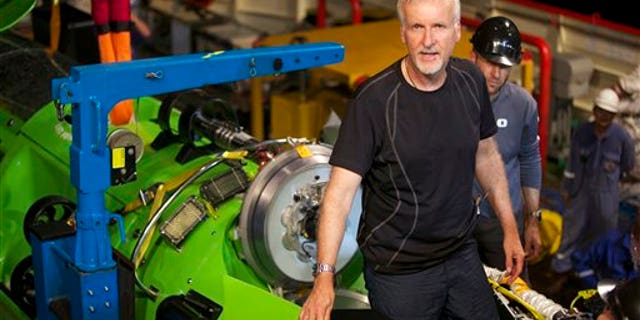 This February 2012 photo, provided by National Geographic, shows explorer and filmmaker James Cameron emerging from the hatch of DEEPSEA CHALLENGER during testing of the submersible in Jervis Bay, south of Sydney, Australia.