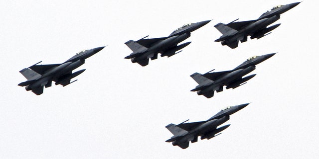 October 10, 2011: Taiwanese F-16 fighter jets fly in formation during national day celebrations of the centenial anniversary of the founding of the Republic of China government in Taipei, Taiwan