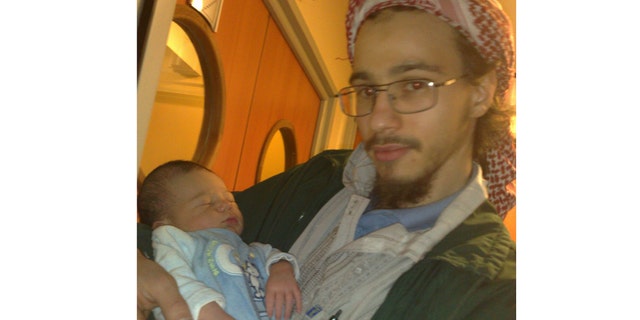 Farid Benyettou holding his nephew.