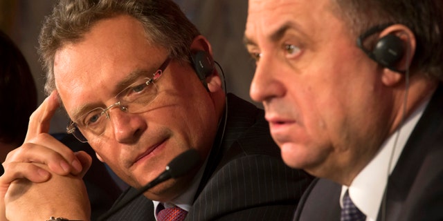 FILE - In this Feb. 16, 2015, file photo, FIFA Secretary General Jerome Valcke, left, and Russian Sports Minister Vitaly Mutko attend a news conference in St. Petersburg, Russia. (AP Photo/Dmitry Lovetsky, File)