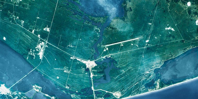 This view, captured from the Space Shuttle Atlantis (oriented with north to the right), shows the John F. Kennedy Space Center. At the far right is Mosquito Lagoon and to the left is the Banana River.