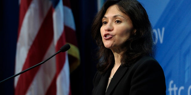Jan. 15, 2014: Federal Trade Commission (FTC) Chair Edith Ramirez speaks at the FTC in Washington, where she announced Apple will refund $32.5 million to consumers to settle a federal case involving purchases that kids made without their parents' permission while playing on mobile apps.