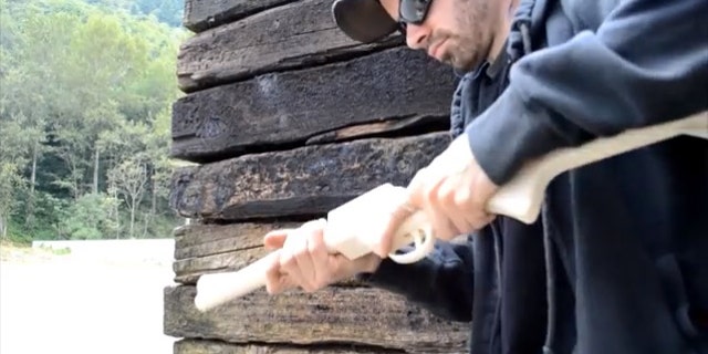 A man who would identify himself only as "Matthew" fires a homemade rifle he calls "The Grizzly 2.0" in a YouTube video.