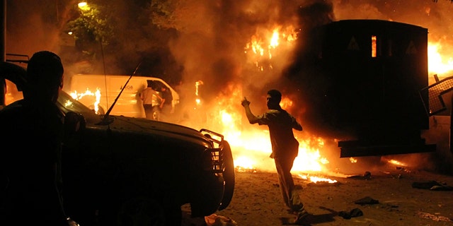 Sept. 9, 2011: Protesters are seen among flaming vehicles outside the building housing the Israeli embassy in Cairo, Egypt. A Facebook page calls for a fresh protest against the Israeli embassy in Amman, Jordan, sparking fears of more violence.