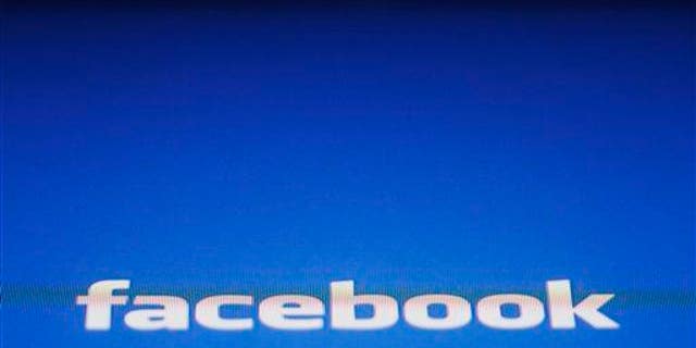 In this May 16, 2012 file photo, a Facebook logo is displayed on the screen of an iPad in New York.