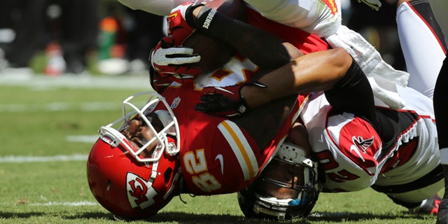 Sept. 8, 2012: Kansas City Chiefs wide receiver Dwayne Bowe (82) is tackled by Atlanta Falcons cornerback Brent Grimes (20) during the first half of an NFL football game at Arrowhead Stadium in Kansas City, Mo.