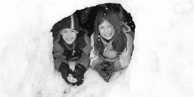 Feb. 26, 2010: Friedlander family photo shows Gregory and Molly Friedlander play in the snow at their home in Cross River, N.Y.