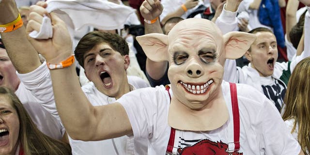FAYETTEVILLE, AR - JANUARY 14: Fans of the Arkansas Razorbacks celebrate after an overtime win against the Kentucky Wildcats at Bud Walton Arena on January 14, 2014 in Fayetteville, Arkansas. The Razorbacks defeated the Wildcats 87-85. (Photo by Wesley Hitt/Getty Images)