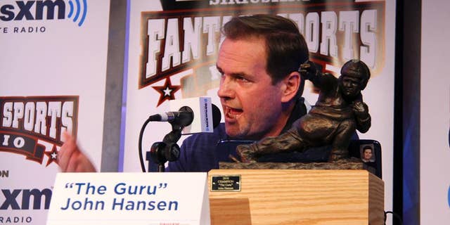 In this photo taken on July 28, 2011, and provided by SiriusXM, John Hansen speaks at the SiriusXM Celebrity Fantasy Football Draft at the Hard Rock Cafe in New York. Hansen started out faxing and snail-mailing his fantasy football advice and hosting a local cable TV show. Technology has supercharged the growth of fantasy leagues, and now Hansen appears nationally on satellite radio and television talking about who to start and sit. (AP Photo/SiriusXM, Maro Hagopian)