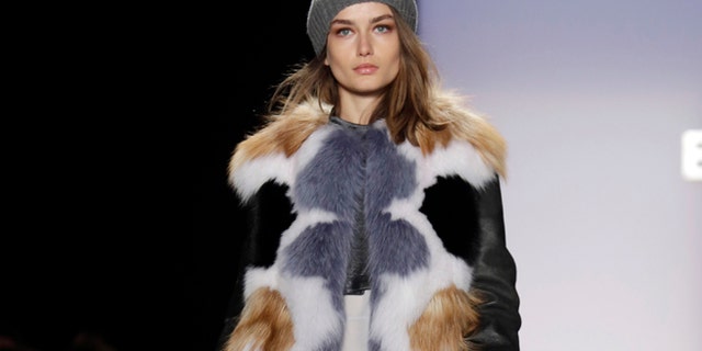 The BCBG Max Azria Fall 2013 collection is modeled during Fashion Week in New York on Thursday, Feb. 7, 2013.