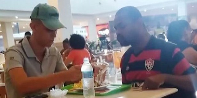 The woman who recorded the exchange said she was moved to tears by it.