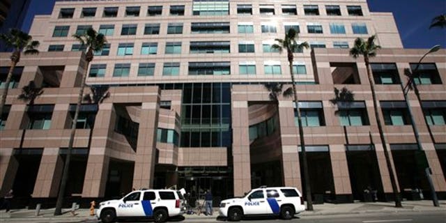 Feb. 17: Homeland Security police cars are shown parked outside the Long Beach, Calif., Federal Courthouse in Long Beach, Calif.