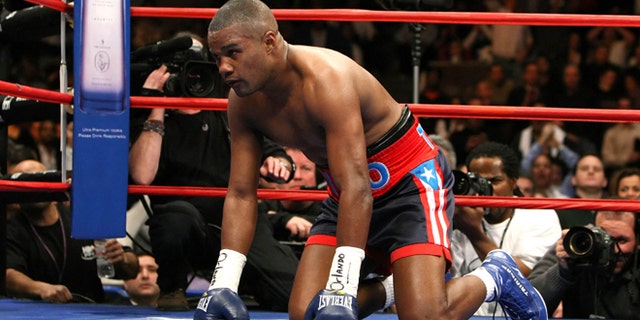 NEW YORK - JANUARY 19: Tito Trinidad kneels on the canvas after receiving a punch from Roy Jones Jr. during their Light Heavyweight bout at Madison Square Garden January 19, 2008 in New York City. (Photo by Al Bello/Getty Images)