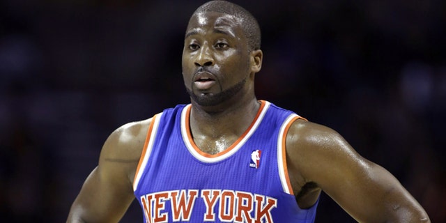 In this Friday, Nov. 8, 2013 photo, New York Knicks guard Raymond Felton catches his breath during a break in the action in an NBA basketball game against the Charlotte Bobcats, in Charlotte, N.C. New York police say Felton has been arrested on three counts of criminal possession of a weapon. Sgt. Thomas Antonetti says Felton turned himself in at 12:50 a.m., Tuesday, Feb. 25, 2014, and was questioned in the 20th Precinct in Manhattan, hours after his team lost at home to the Dallas Mavericks. (AP Photo/Nell Redmond)