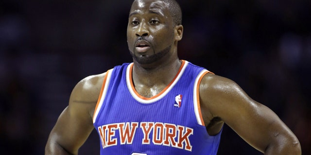 In this Friday, Nov. 8, 2013 photo, New York Knicks guard Raymond Felton catches his breath during a break in the action in an NBA basketball game against the Charlotte Bobcats, in Charlotte, N.C. New York police say Felton has been arrested on three counts of criminal possession of a weapon. Sgt. Thomas Antonetti says Felton turned himself in at 12:50 a.m., Tuesday, Feb. 25, 2014, and was questioned in the 20th Precinct in Manhattan, hours after his team lost at home to the Dallas Mavericks. (AP Photo/Nell Redmond)