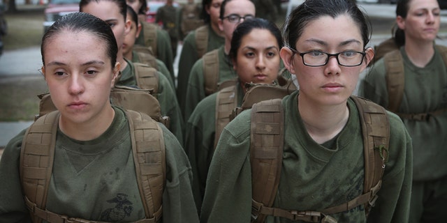 PARRIS ISLAND, SC - FEBRUARY 25: Female Marine recruits stand in formation during boot camp February 25, 2013 at MCRD Parris Island, South Carolina. All female enlisted Marines and male Marines who were living east of the Mississippi River when they were recruited attend boot camp at Parris Island. About six percent of enlisted Marines are female. (Photo by Scott Olson/Getty Images)