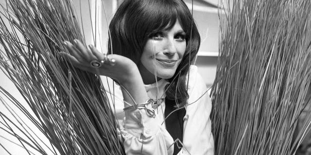 In this Sept. 16, 1971, Fenella Fielding poses ahead of a one woman entertainment piece at the Withy Arts Festival in Somerset, England. British actress Fenella Fielding, the glamorous, velvet-voiced star of "Carry On" comedies, has died at the age of 90.