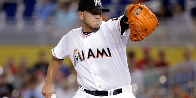 Miami Marlins starting pitcher Jose Fernandez winds up during the first inning of a baseball game against the Cincinnati Reds, Thursday, July 9, 2015,, in Miami. (AP Photo/Lynne Sladky)