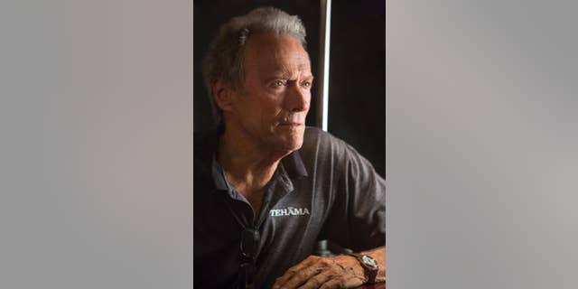 This photo released by Warner Bros. shows director/producer, Clint Eastwood, on the set of Warner Bros. Pictures’ musical “Jersey Boys,” a Warner Bros. Pictures release. (AP Photo/Warner Bros. Pictures, Keith Bernstein)