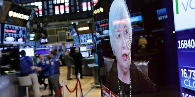 Federal Reserve Chair Janet Yellen's news conference is shown on a television screen, on the floor of the New York Stock Exchange, Thursday, Sept. 17, 2015.