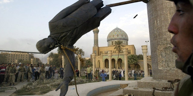 The toppled statue of Saddam Hussein is seen in Firdos Square downtown Baghdad in this April 9, 2003 file photo.