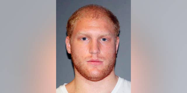 This photo provided Thursday, Sept. 10, 2015 by the Lansing, Mich., Police Department shows Grant Taylor, 22, of Lansing, Mich. Taylor was charged with murder Thursday in the hit-and-run death of a Michigan firefighter who authorities say was deliberately struck by Tayor's pickup truck as he collected money for charity. (Lansing Police Department via AP)