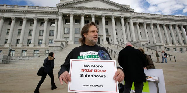 Jan. 27, 2015: Randy Gardner of Salt Lake City, the older brother of Ronnie Lee Gardner, the last inmate to be killed by firing squad in Utah in 2010, protests with a group opposed to capital punishment plans.