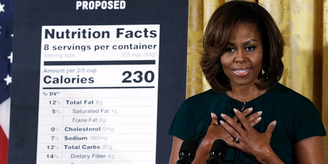WASHINGTON, DC - FEBRUARY 27: U.S. first lady Michelle Obama announces proposed changes to food labels during an event in the East Room of the White House February 27, 2014 in Washington, DC. The proposed changes would highlight the calorie count of all foods, detail added sugars, and prove easier to understand the basic nutritional value of packaged foods. (Photo by Win McNamee/Getty Images)