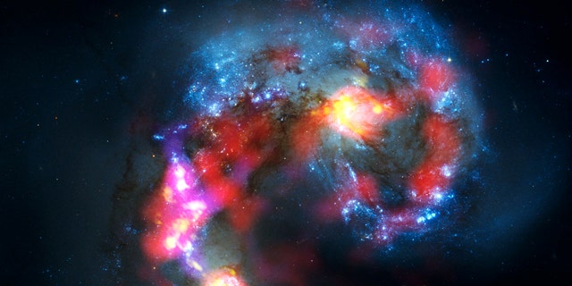 A combined view of the Antennae Galaxies, taken by the ALMA radio telescope array and the Hubble Space Telescope.