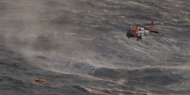 The crew of a Coast Guard Kodiak-based rescue helicopter prepares to rescue one of four crewman from the fishing vessel Northern Belle who managed to climb into a life raft dropped by a Coast Guard aircraft from Air Station Kodiak 50 miles south of Monatgue Island in the Gulf of Alaska. The Northern Belle crew issued a mayday call and abandoned the 75-foot Seattle-based vessel into the chilly waters of the Gulf of Alaska.